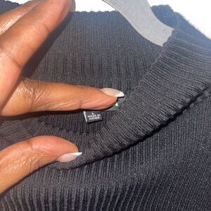 Black Sweater with peak-a-boo sleeves.